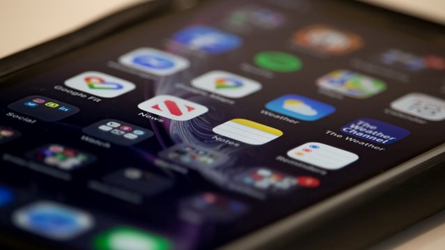 image of a phone with phone apps on the screen